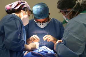 Medical team focused on a surgery, demonstrating healthcare and precision.